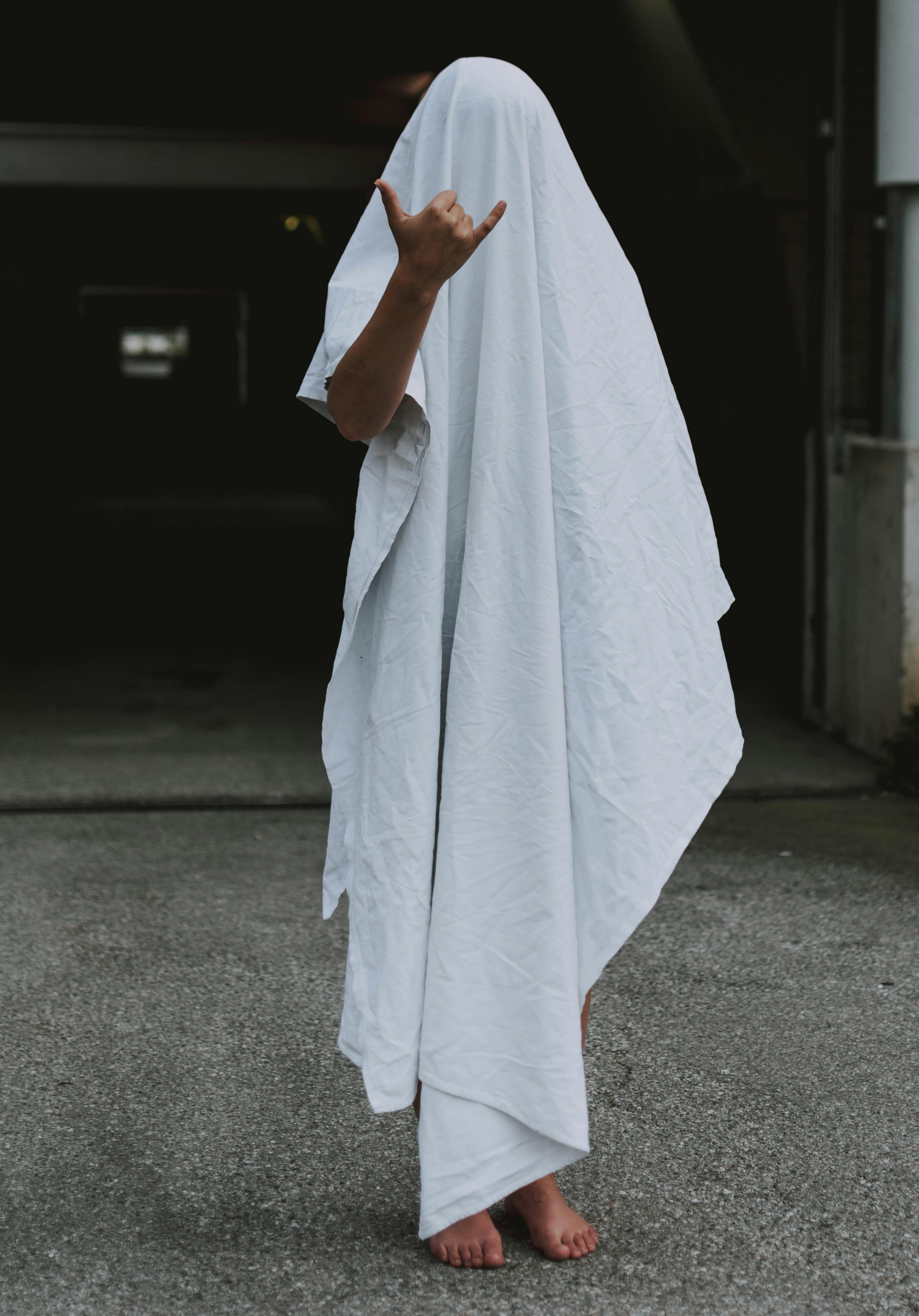 Person Covered with White Towel Closeup Photography · Free Stock Photo