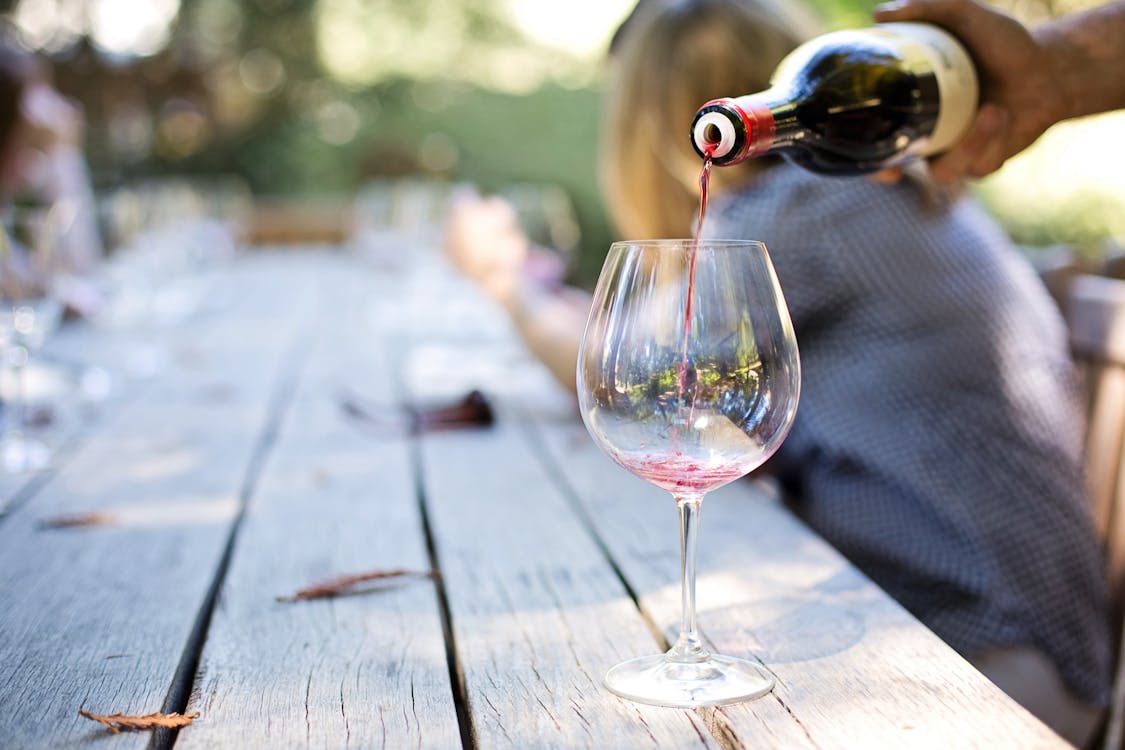 Free Wine Poured in Long-stem Glass Stock Photo