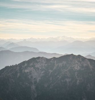 Tranquil layers of mountains in Bayrischzell, Germany, creating a serene and natural vista.
