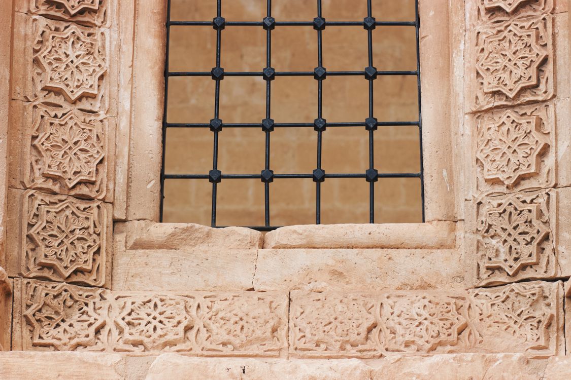 Window Grate Patterns Ornate Stone Carved Window with Iron Grate Design · Free Stock Photo