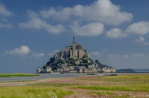 Free Stunning view of Le Mont-Saint-Michel against a blue sky in Normandie, France. Stock Photo