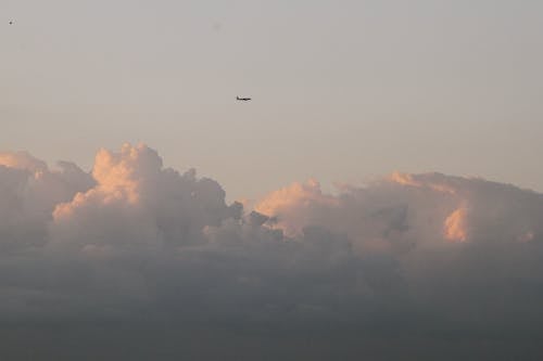 Plane Flying over Clouds