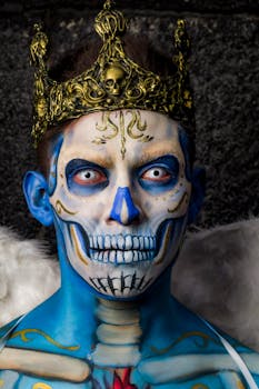 Portrait of a person with skull makeup wearing an ornate golden crown, ideal for Halloween or artistic themes.