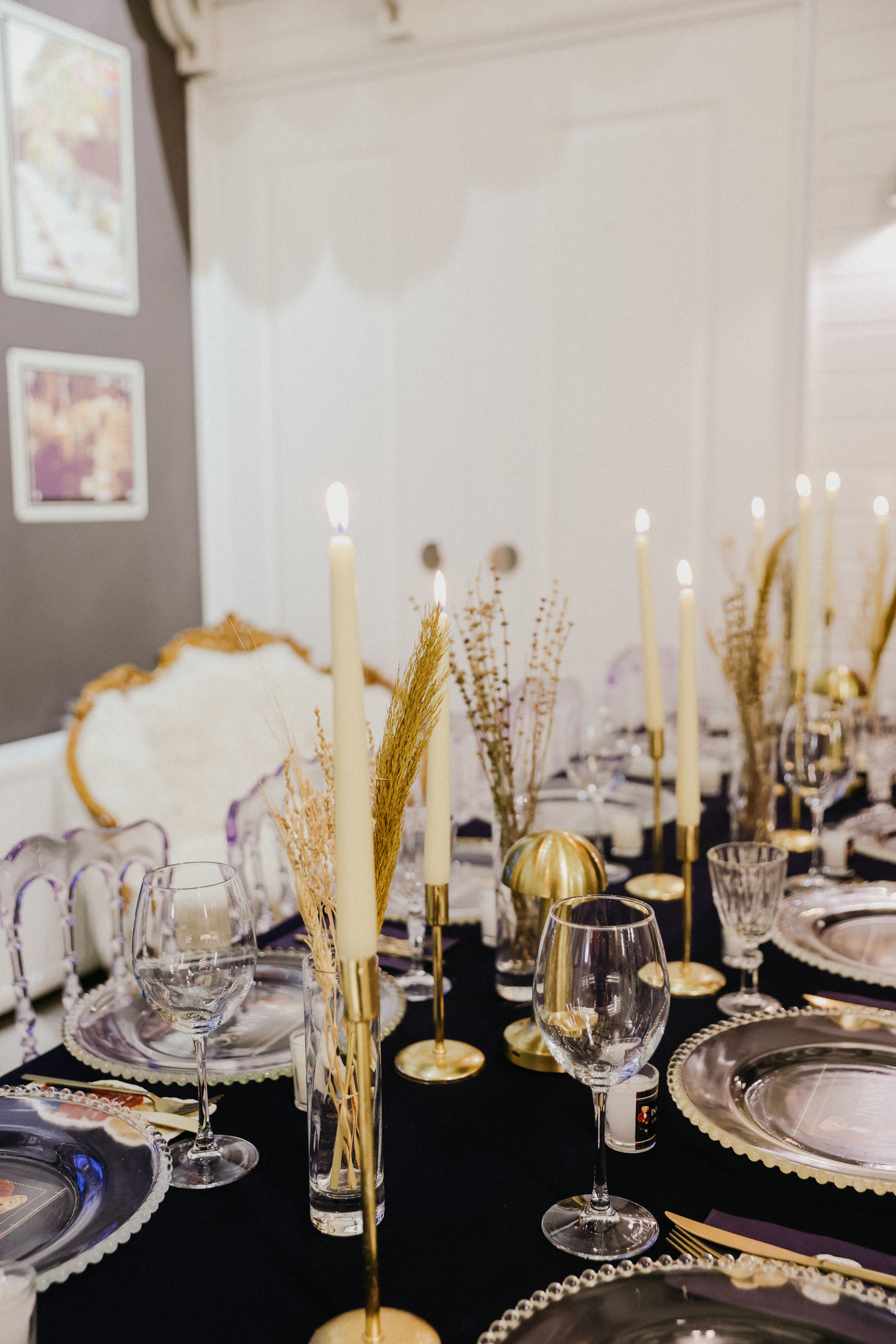 Candlelit fine dining table with fine china and crystal glassware