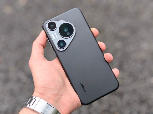Free Detailed handheld shot of a modern smartphone, focusing on the camera design and features. Stock Photo