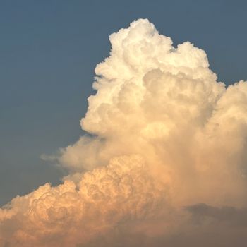 Majestic cumulus clouds over Mumbai at sunset, showcasing a vibrant sky.