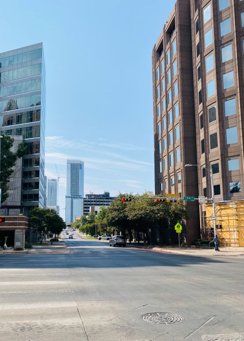 Free Vibrant downtown Austin street view with modern skyscrapers under a clear blue sky. Stock Photo
