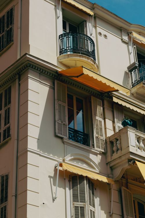 Free Captivating view of classic Mediterranean architecture in sunny Monaco with stylish iron balconies. Stock Photo
