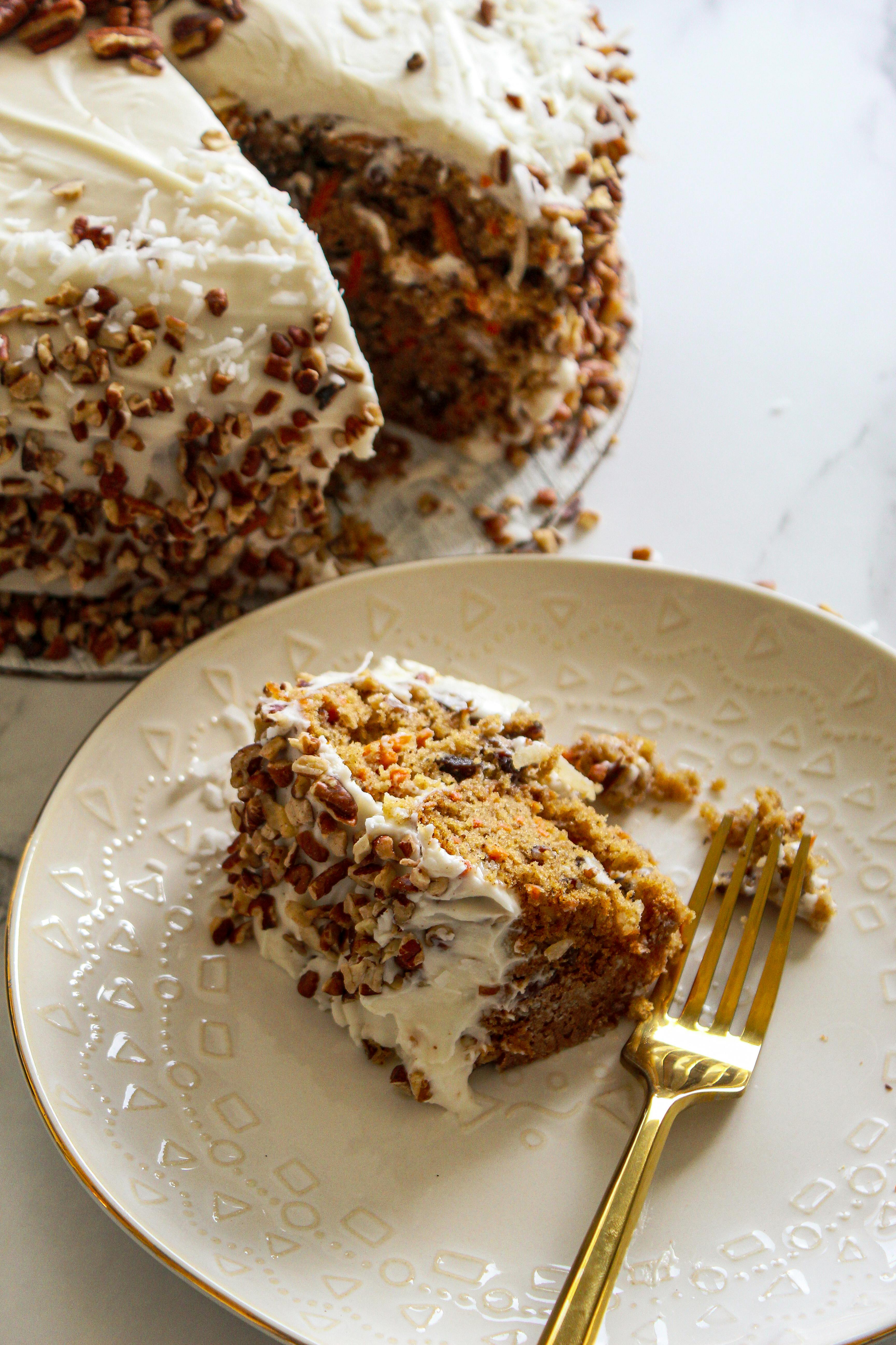 Scrumptious carrot cake slice topped with rich frosting, perfect for dessert lovers.