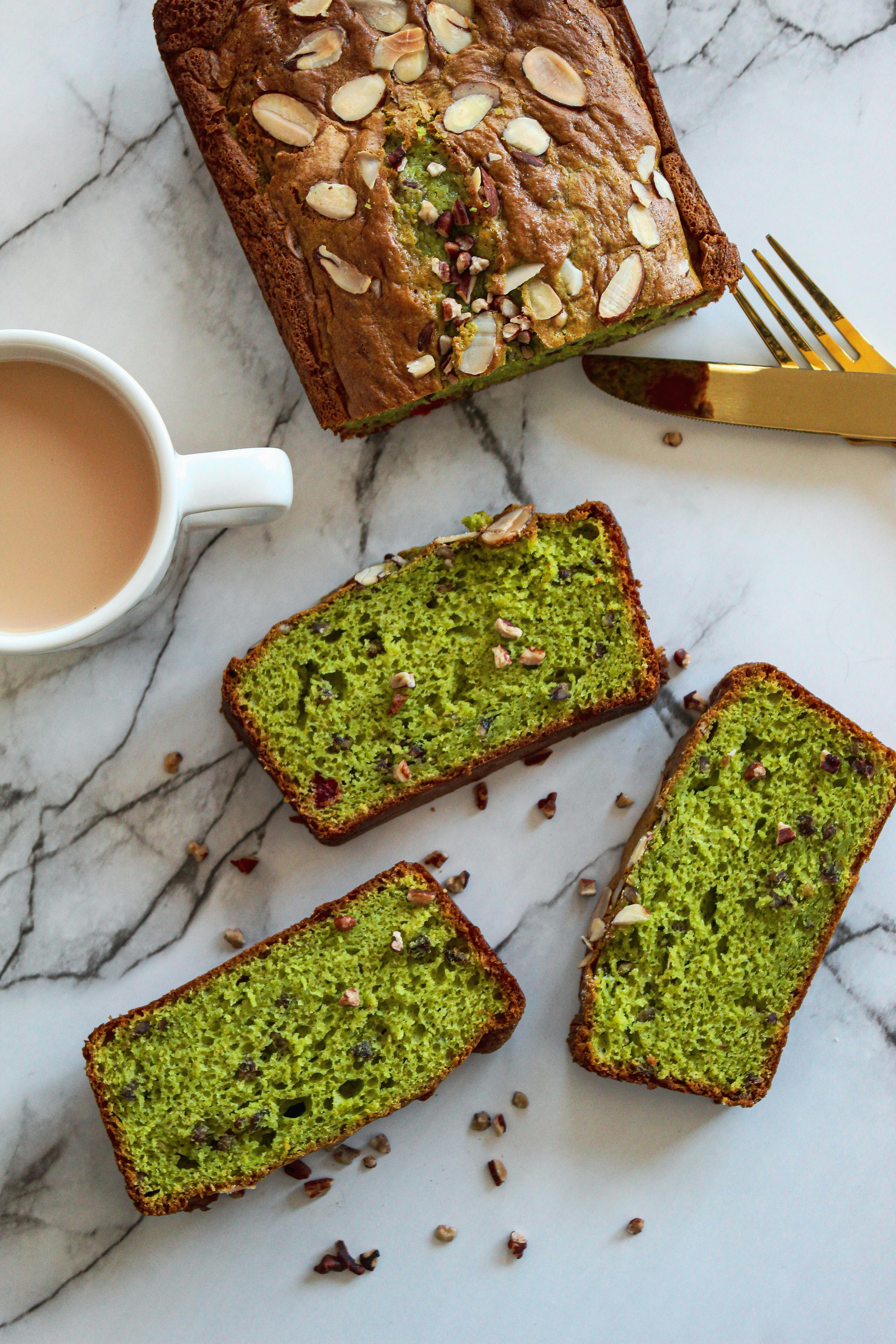 Freshly baked pistachio bread with almond slices on a marble table, Atlanta, Georgia.