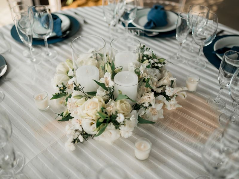 White floral centrepiece with candles