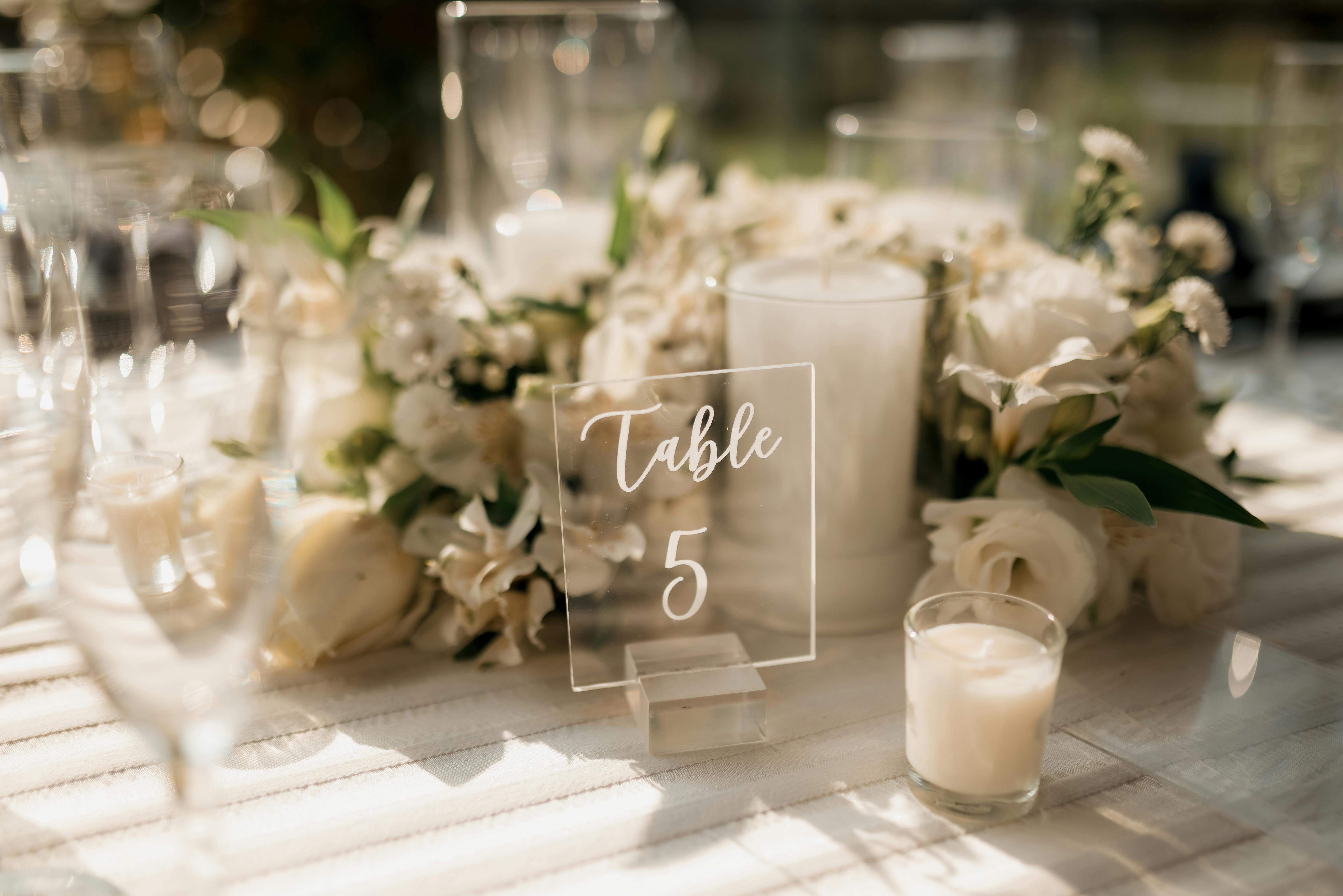 Beautiful wedding table setup with floral centerpiece and candles, perfect for a romantic ambiance.