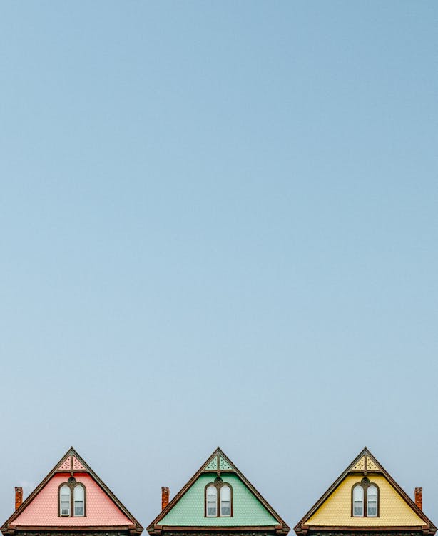Three Pink, Green, and Yellow Houses