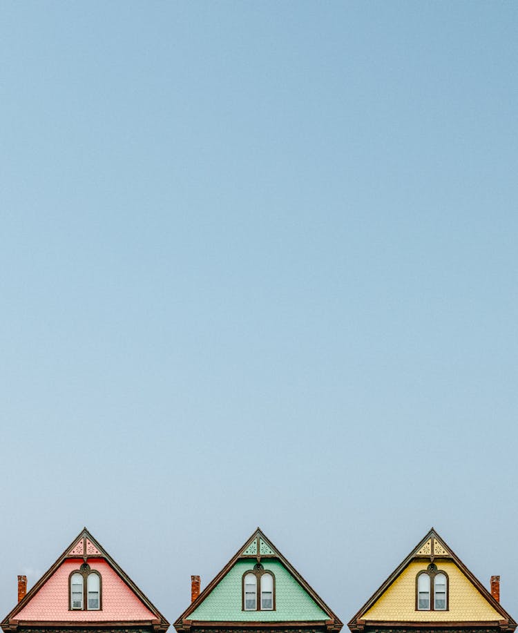 Three Pink, Green, And Yellow Houses