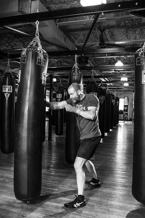 Man Standing Near Heavy Bag