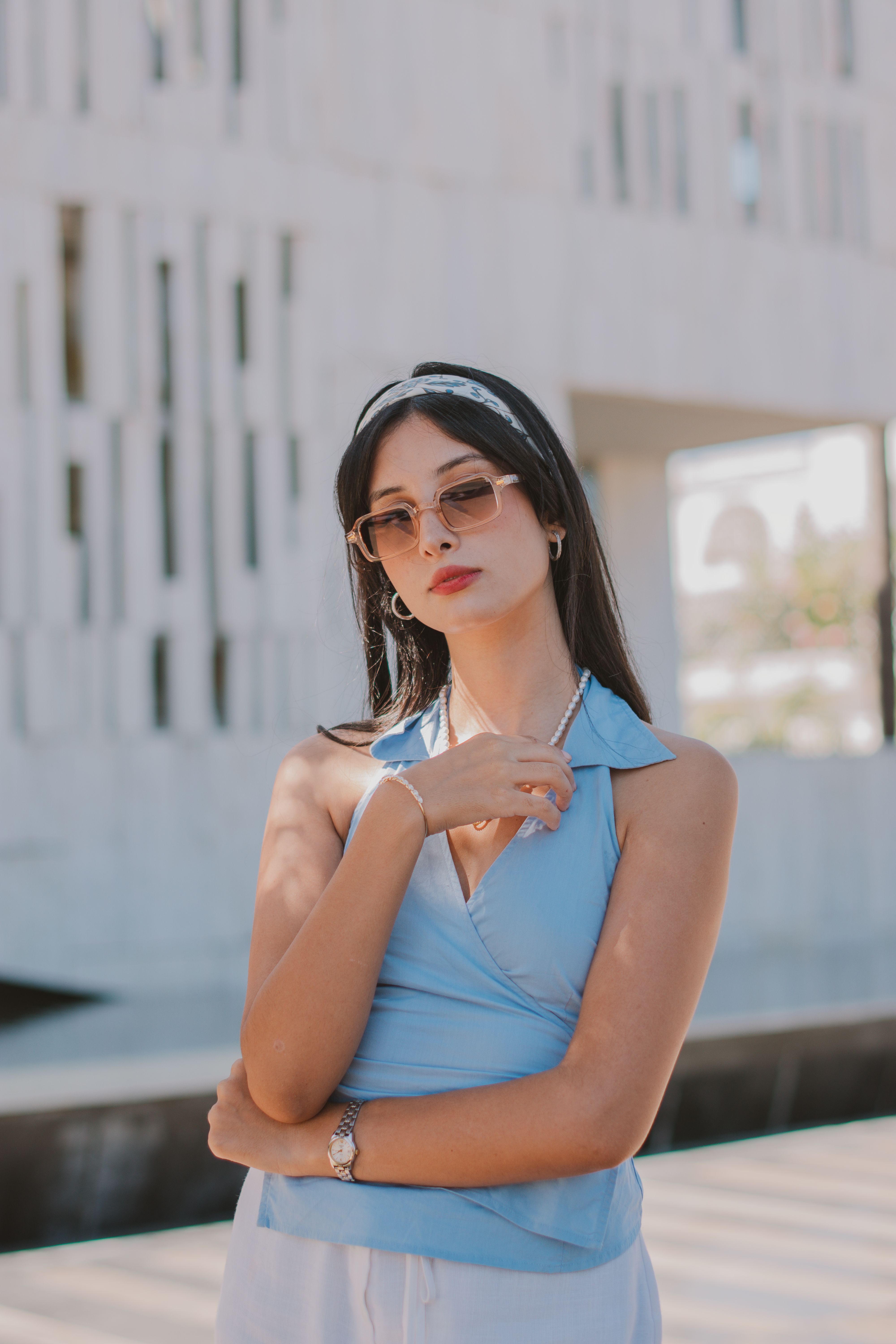 Stylish Woman Posing Outdoors in Sunglasses · Free Stock Photo
