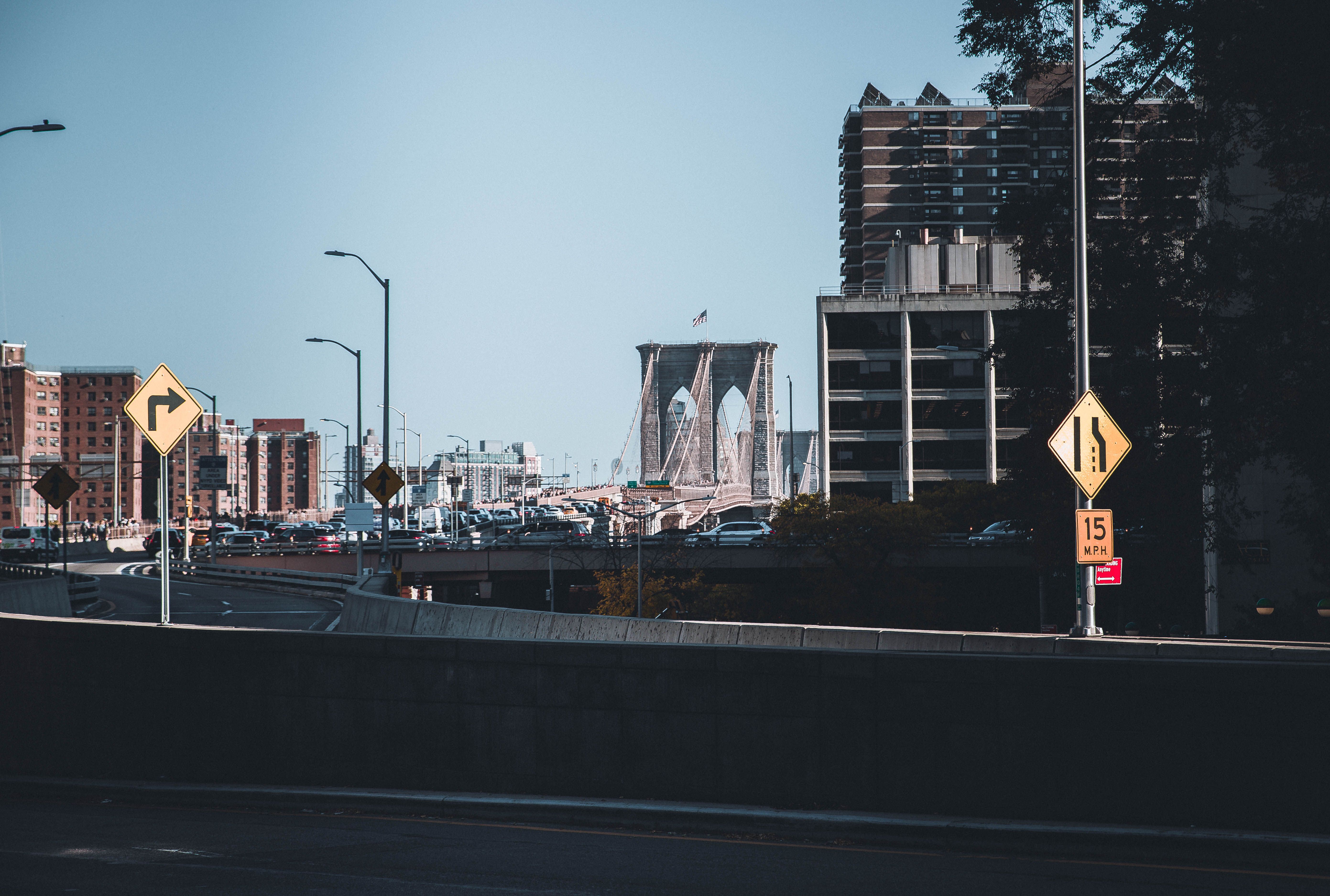 View of the Brooklyn Bridge and city buildings in New York City's urban landscape.