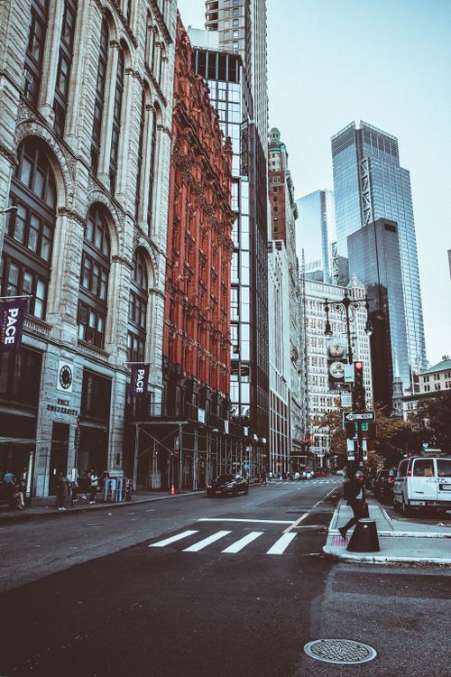 Free Bustling New York City street with historic and modern architecture, showcasing urban life. Stock Photo