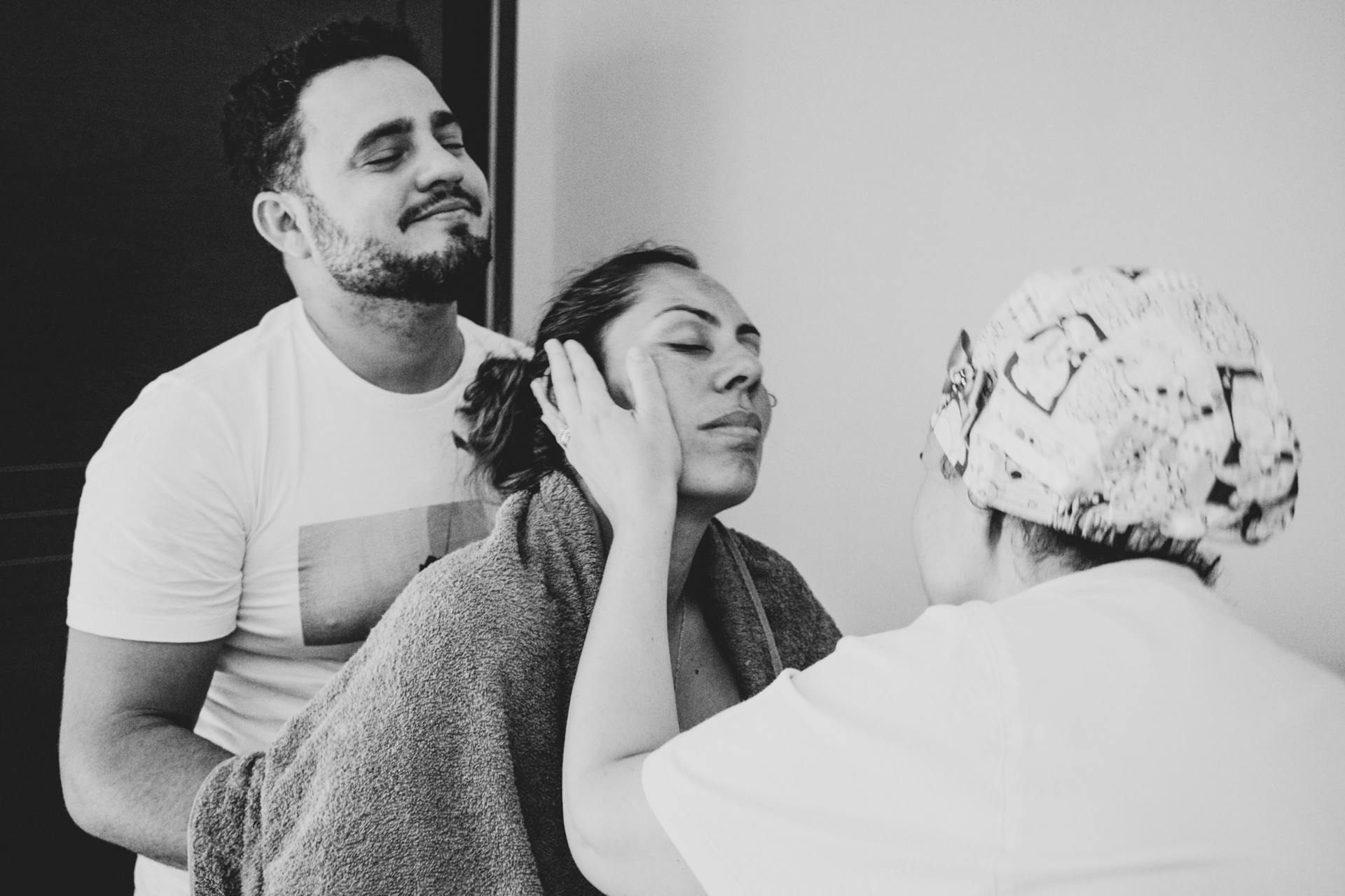 A serene moment of emotional support during labor, highlighting care and connection.