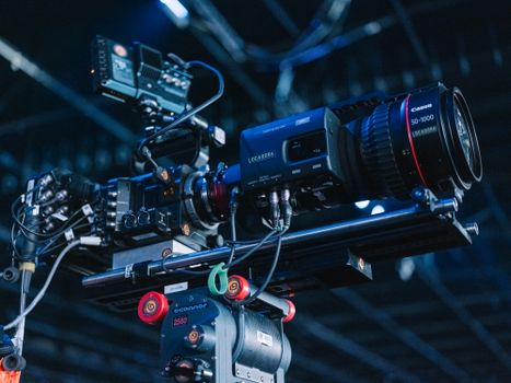 Close-up of advanced camera setup in a studio environment.