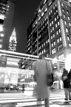 Black and white photo capturing the bustling night life in Midtown Manhattan, NYC.