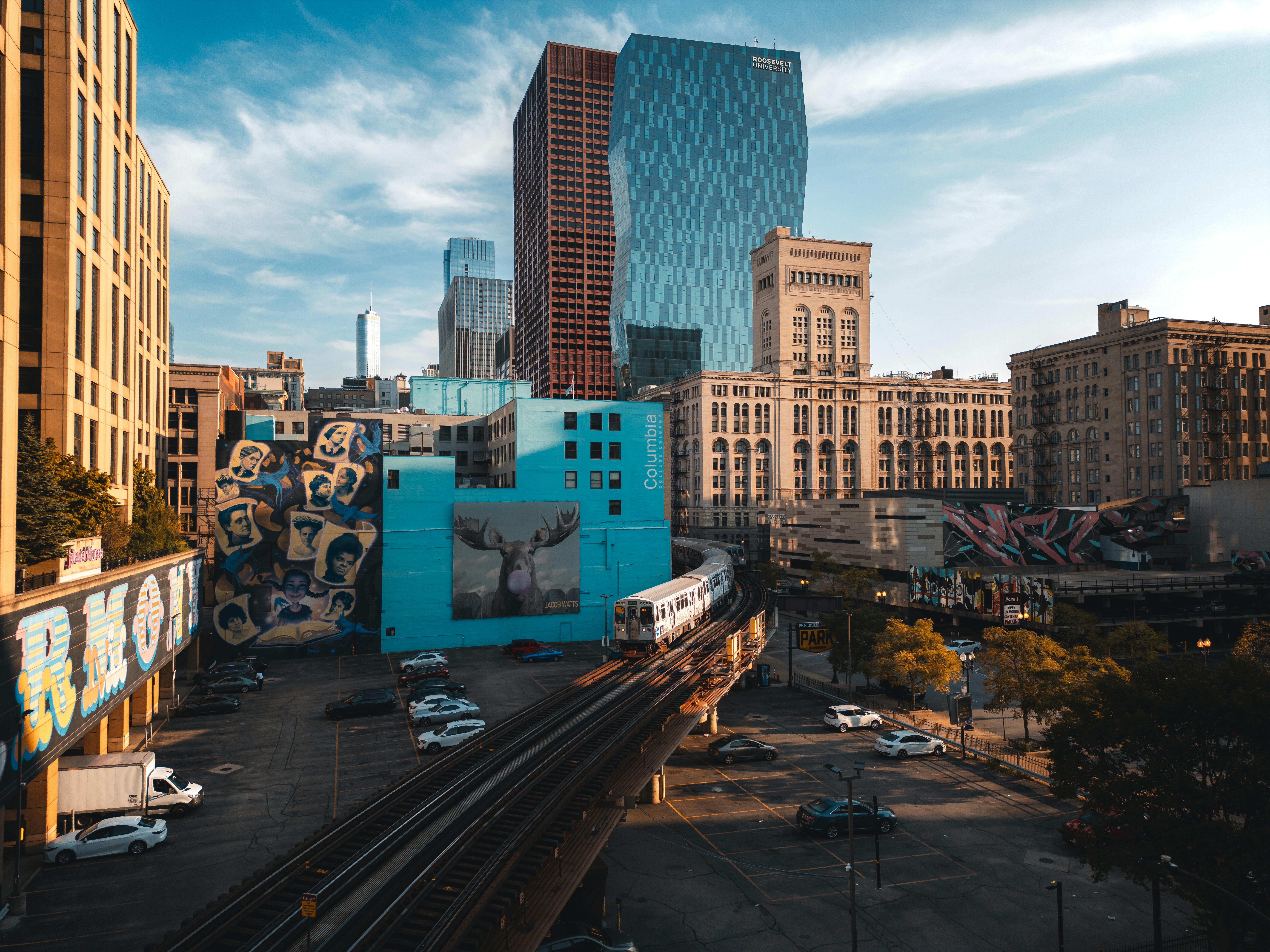 Chicago liftd train with modern apartment buildings in background - modern apartments for rent in chicago