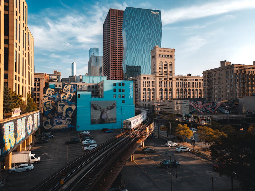 Chicago liftd train with modern apartment buildings in background - modern apartments for rent in chicago Chicago liftd train with modern apartment buildings in background - modern apartments for rent in chicago