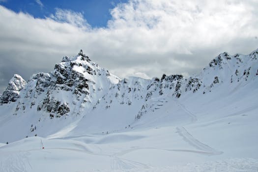 Breathtaking snowy mountain with clear skies, ideal for winter sports and adventure