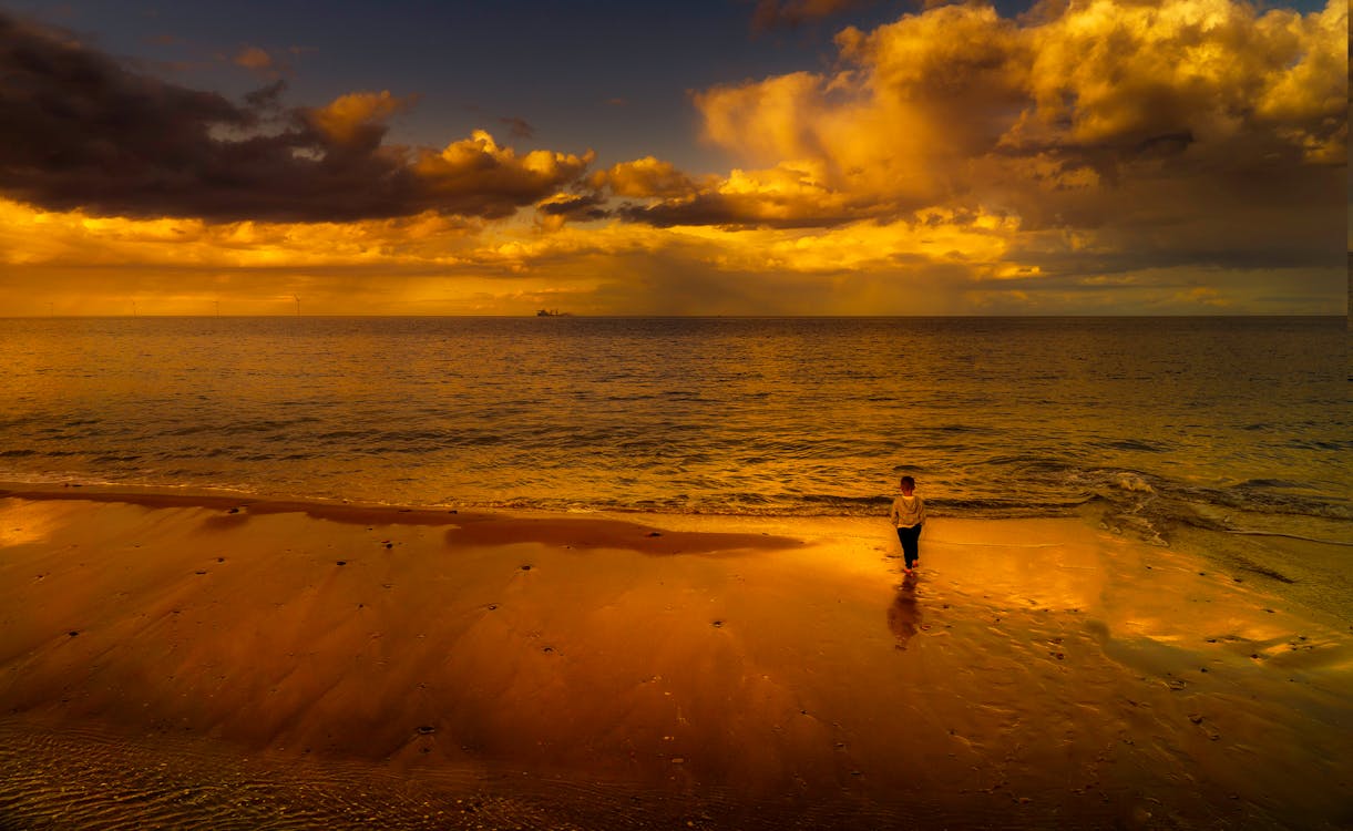 Child Standing on Seashore