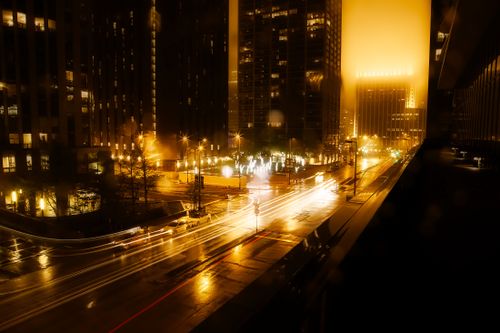 Free Vibrant cityscape at night featuring light trails and illuminated skyscrapers. Stock Photo