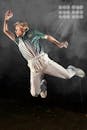 Dynamic Action Shot of Cricketer in Mid-Air