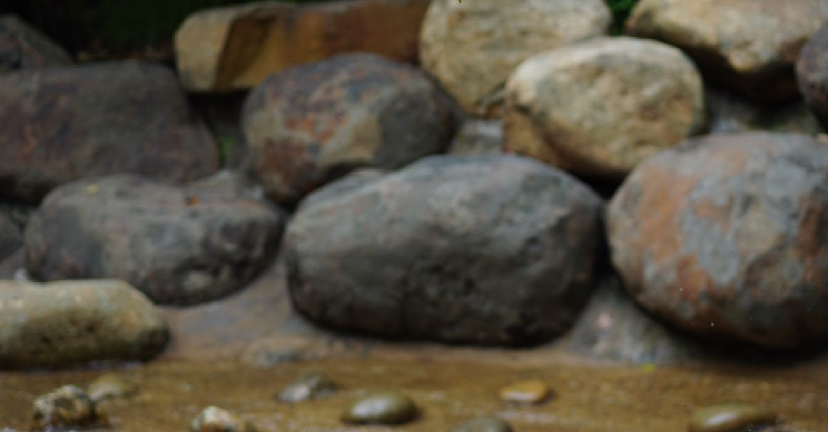 Smooth Stream Rocks Serene Mountain Stream with Smooth Rocks · Free Stock Photo