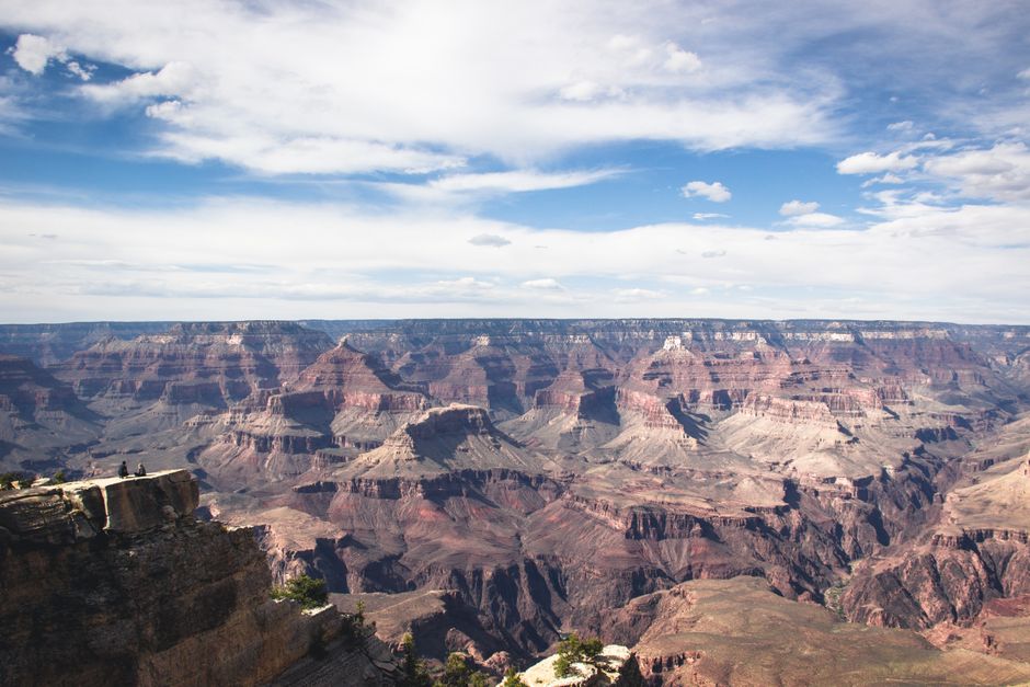 Grand Canyon Deluxe Helicopter Tour with Landing from Las Vegas - A breathtaking view of the Grand Canyon showcasing its majestic rock formations and expansive landscape under a clear sky.