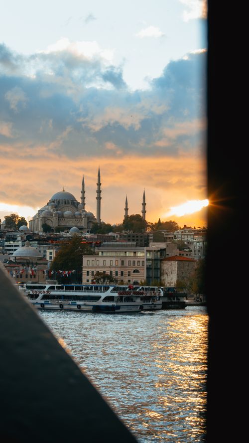 Free Breathtaking sunset over Istanbul featuring Suleymaniye Mosque and Bosphorus waters. Stock Photo