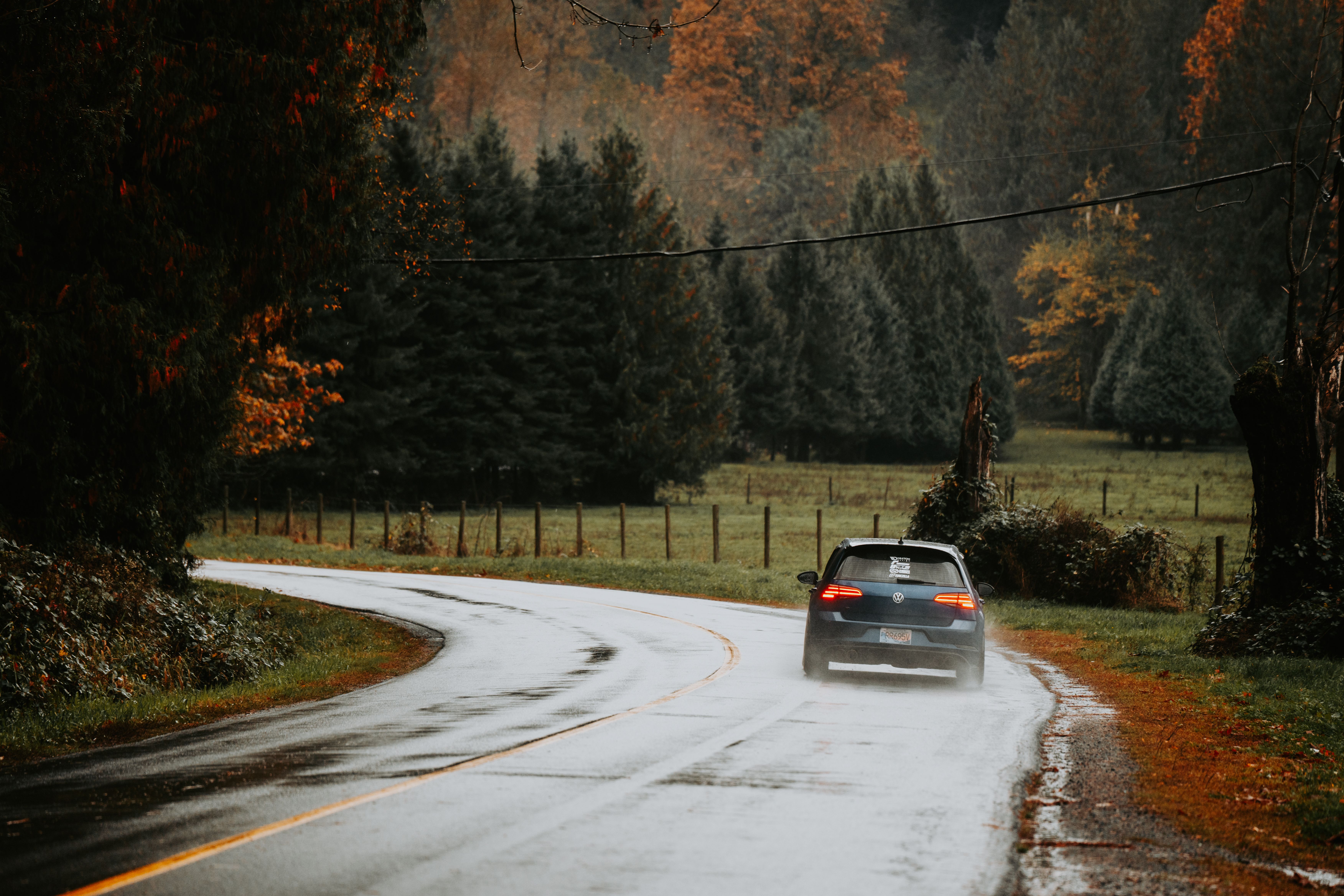 car driving on wet rainy road