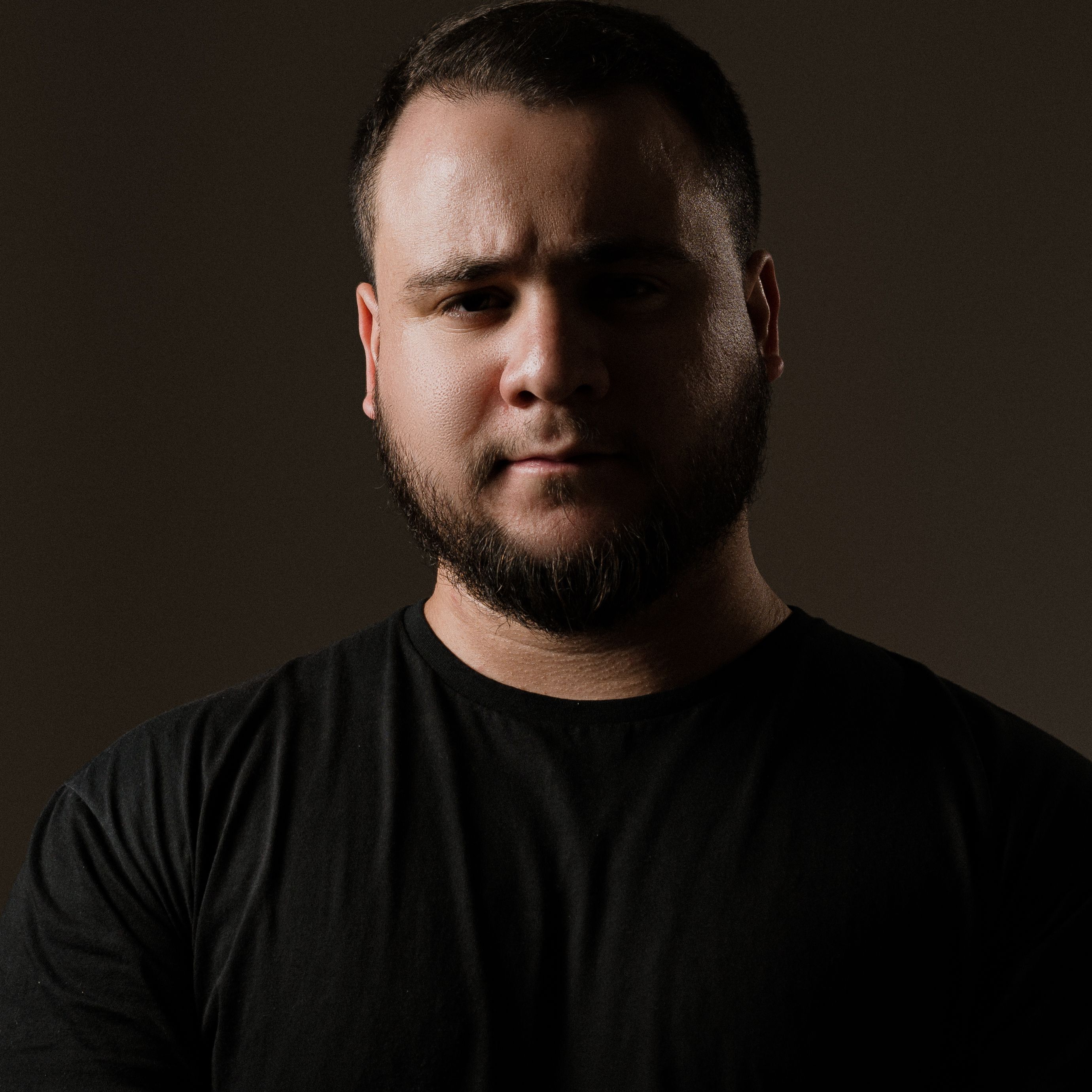 Moody Portrait of Bearded Man in Dark Setting