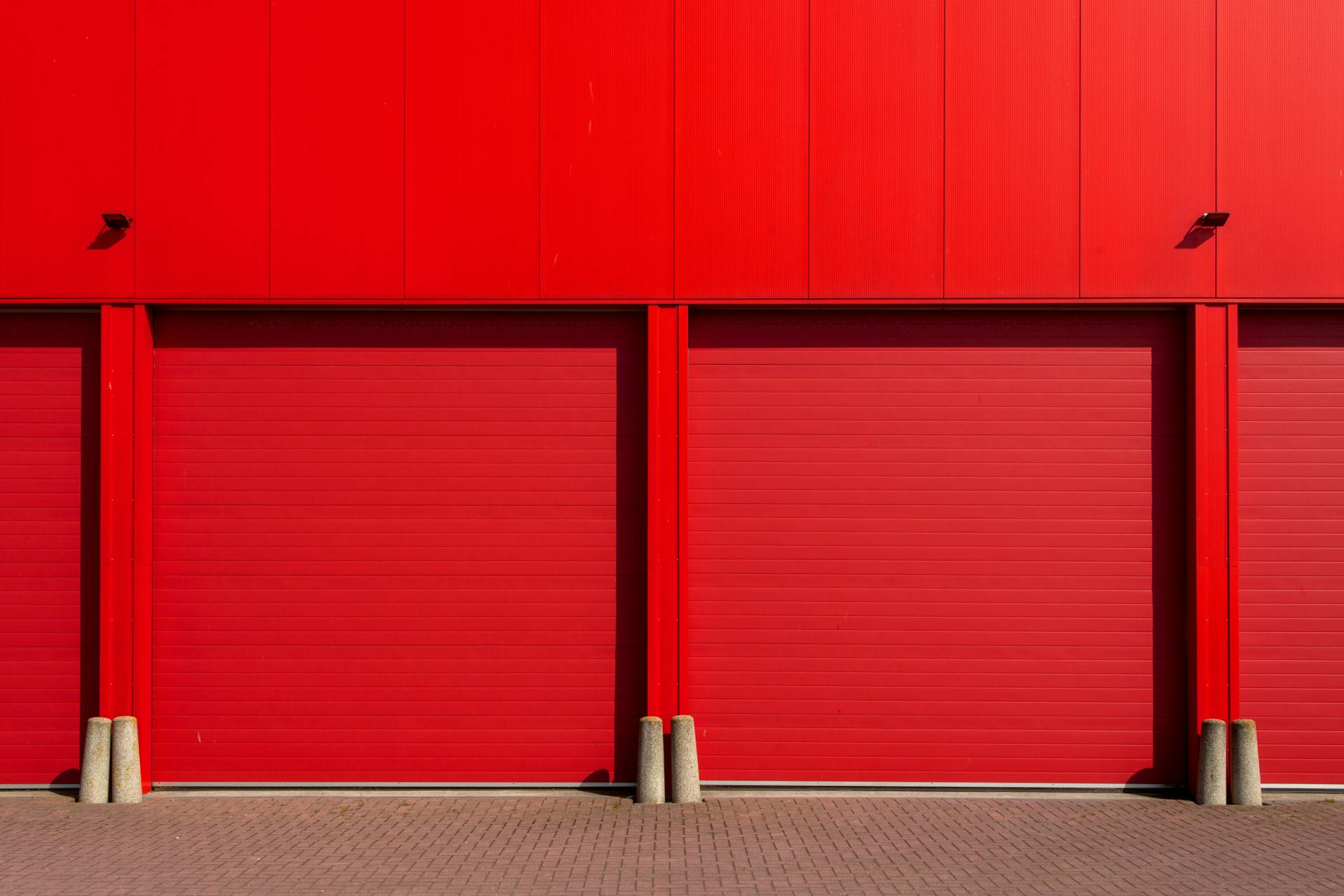Bold Red Garage Doors in Industrial Setting
