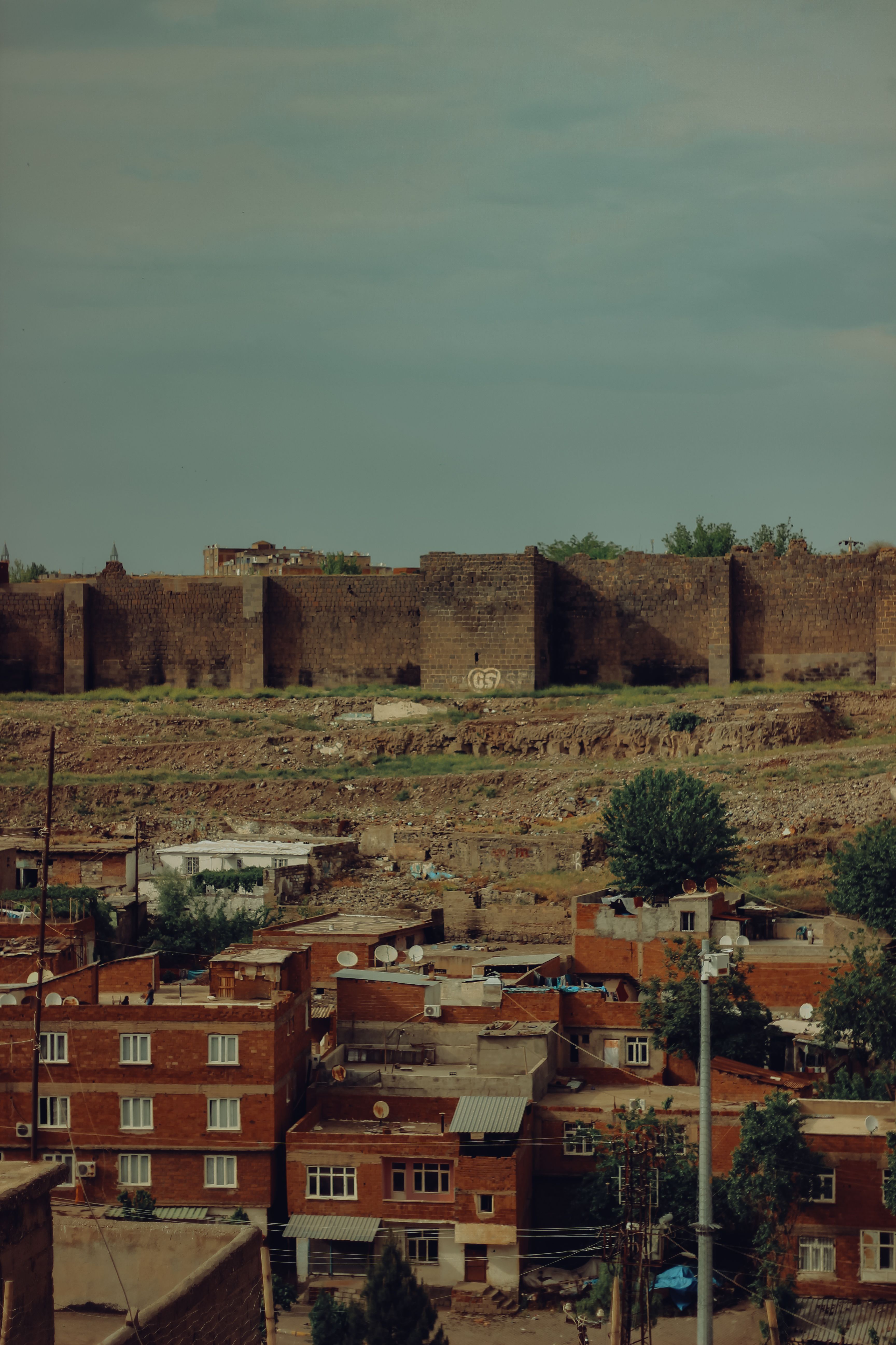 historic walls overlook brick cityscape