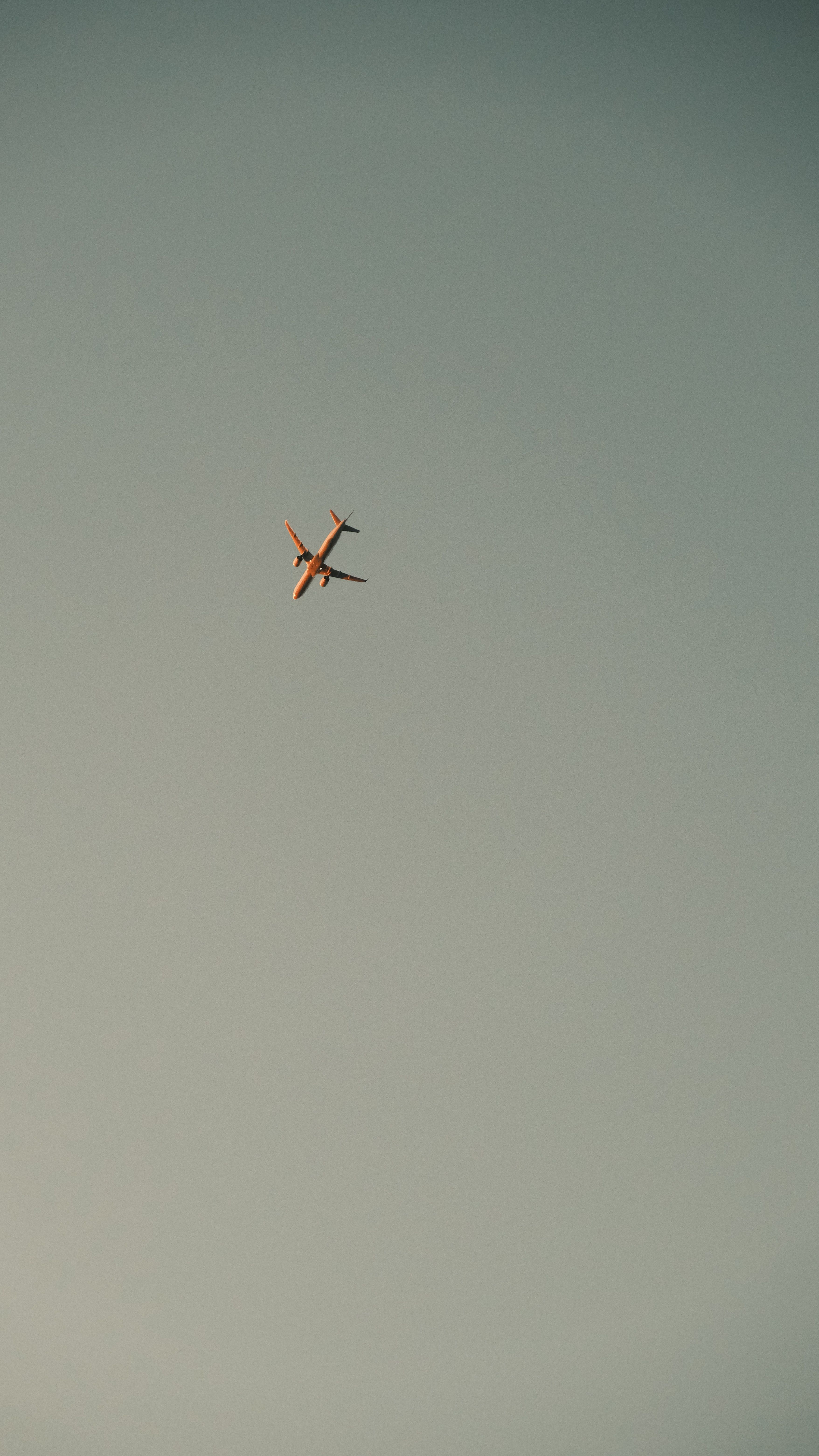 Airplane Against Clear Blue Sky With Ample Copyspace · Free Stock Photo