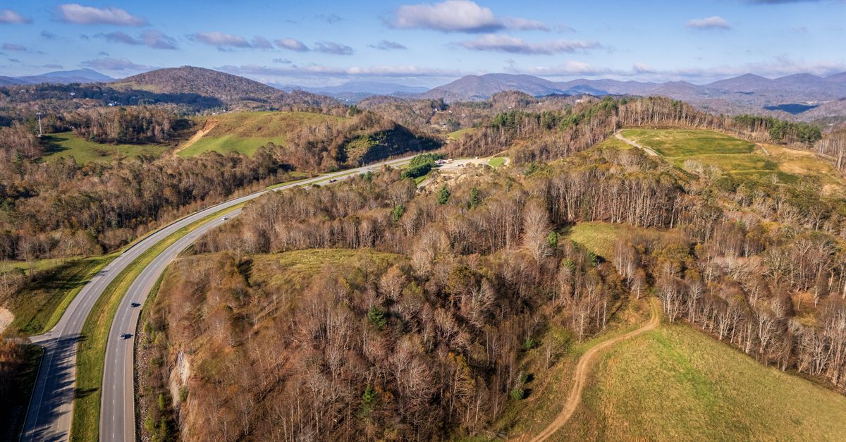 Aerial view of a winding highway through the Appalachian Mountains in North Carolina.