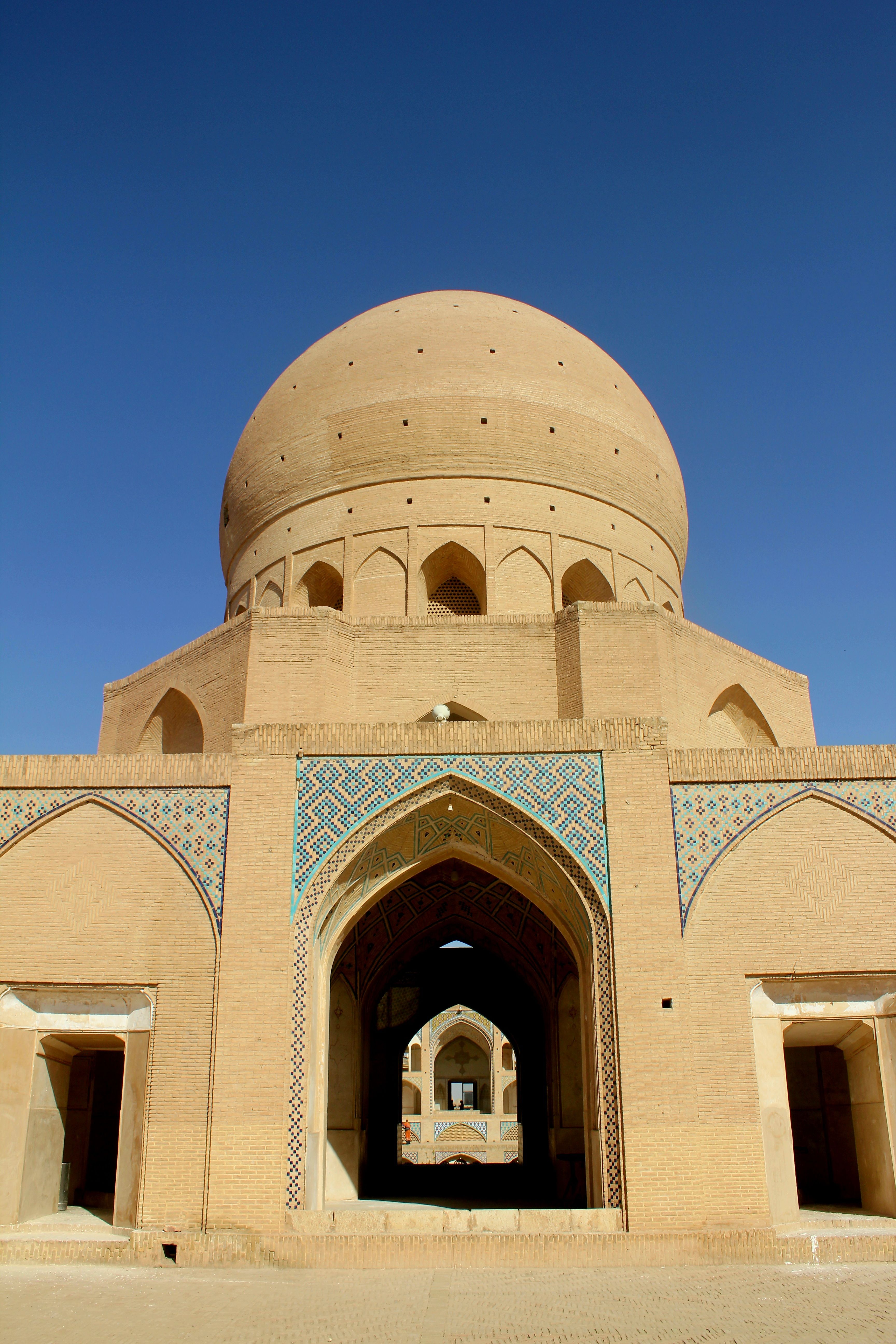 Stunning photograph of ancient Islamic architecture with bright blue sky backdrop.