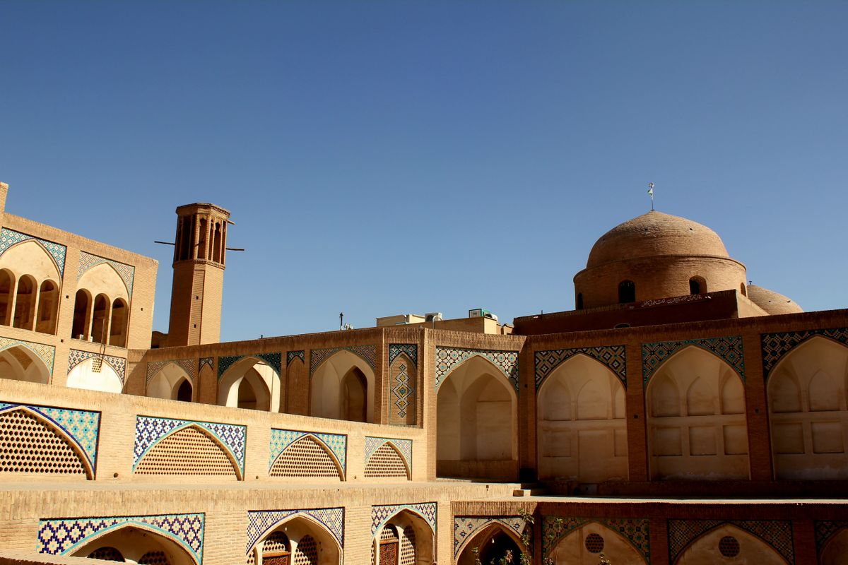 Yazd's mud-brick old city — wind towers and domed rooftops unchanged across centuries.