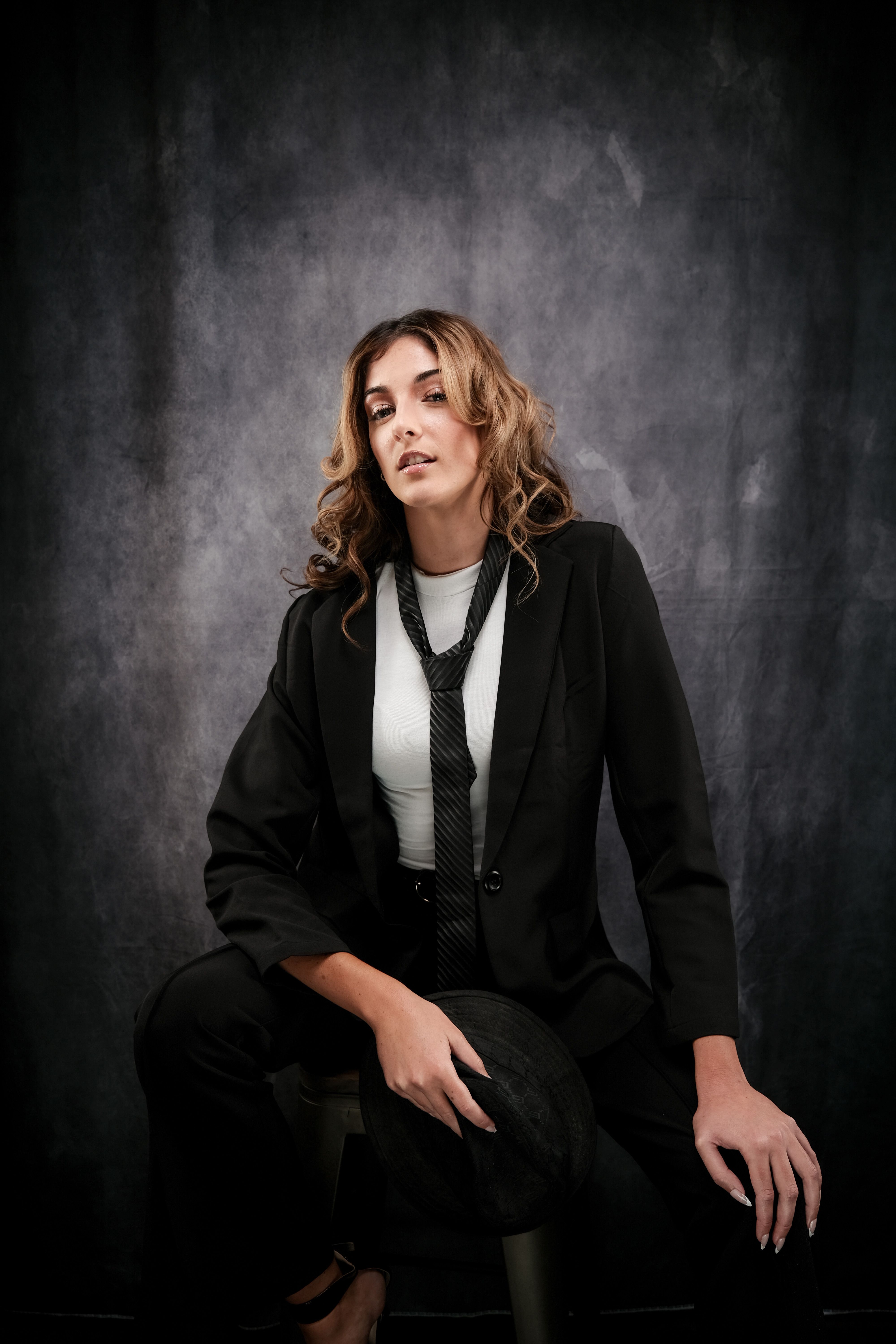 Confident Woman in Black Suit with Tie · Free Stock Photo