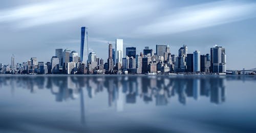 Free Cityscape Photography Near Water Stock Photo