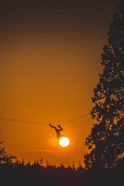 Free Person Hanging on Wire Stock Photo