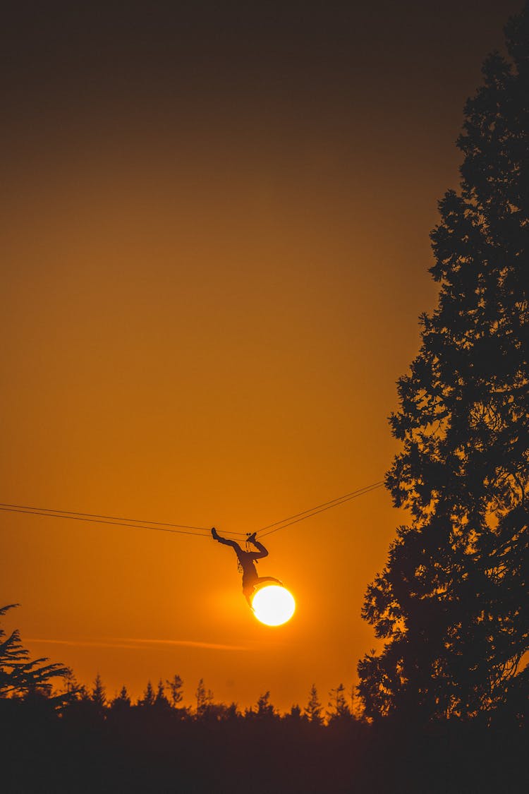 Person Hanging On Wire