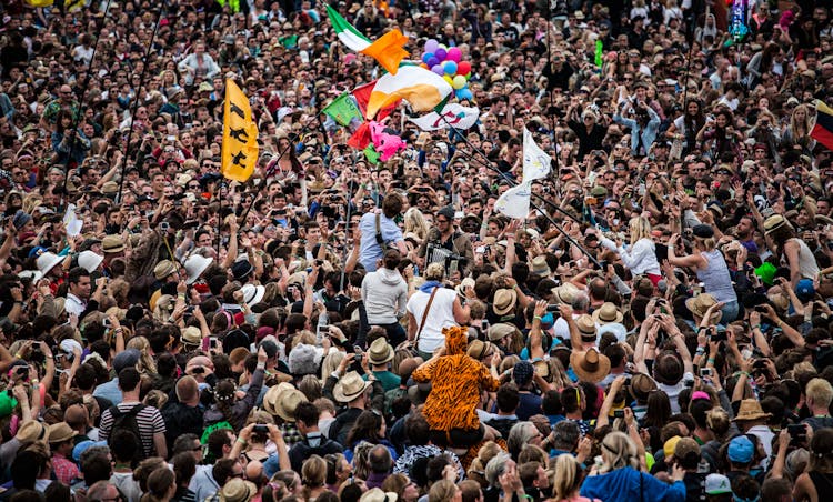 Crowd Of People Standing Outdoors