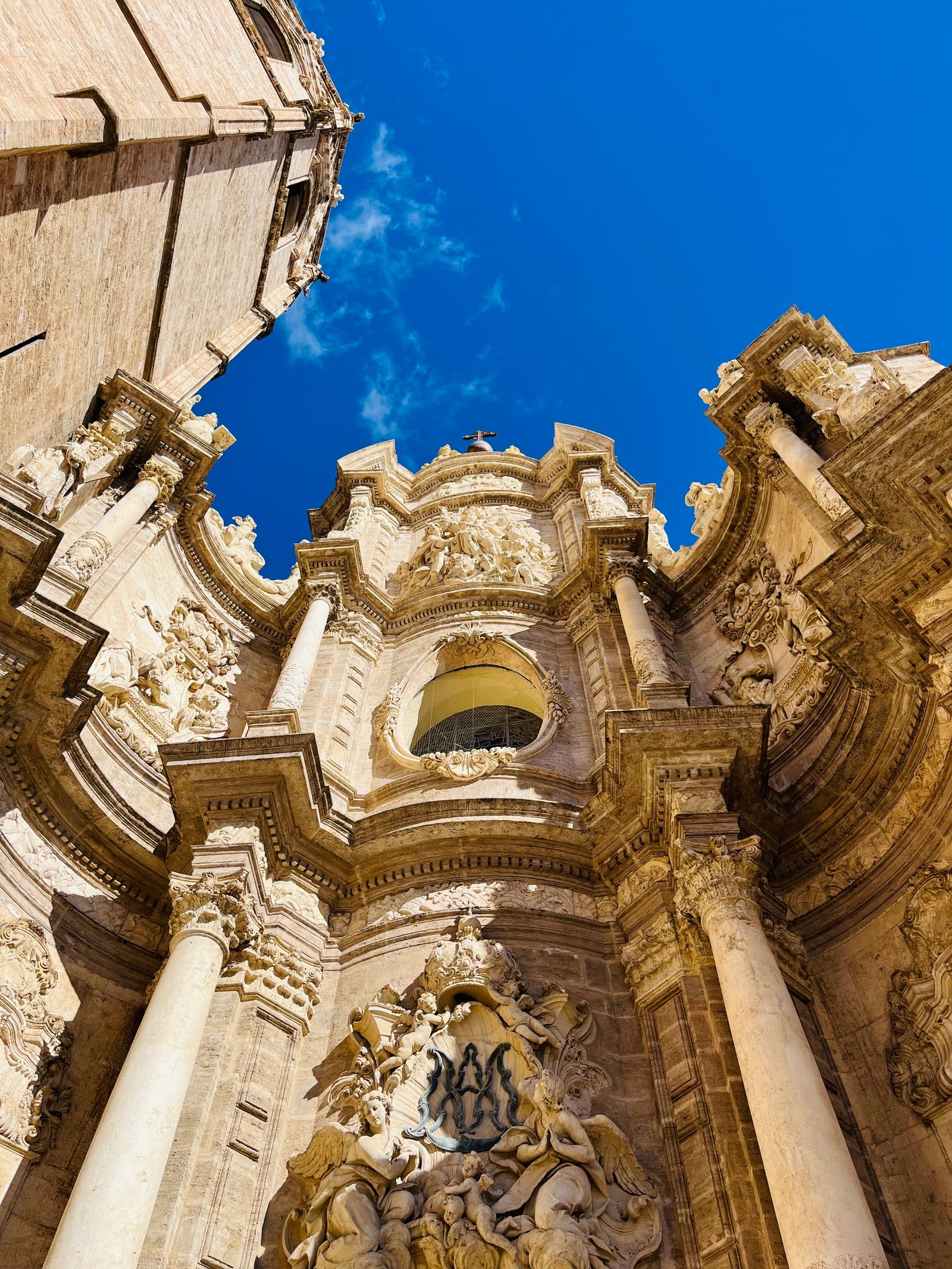 Valencia Cathedral facade against a bright blue sky