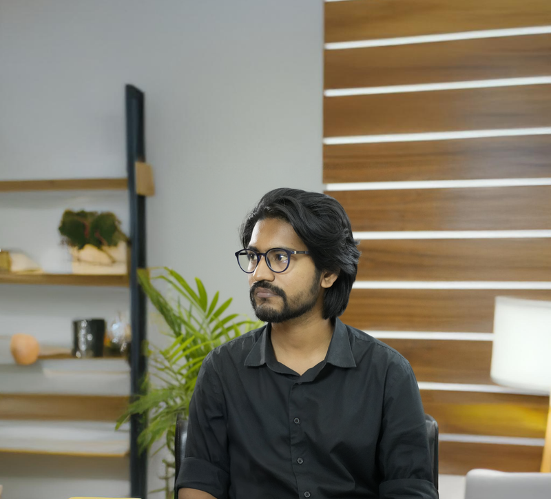 Portrait of a young professional in a modern office with wooden panel decor