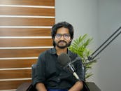 Professional Podcaster in Studio with Microphone